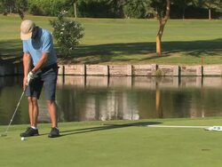 Golfer putting ball, medium shot, Spain Stock Footage