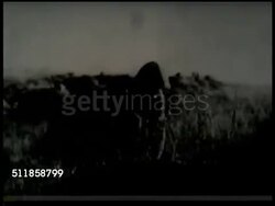 1937: SECOND SINO-JAPANESE WAR: TU MS Japanese soldiers marching, others BG, TU Soldiers watching above, VS Japanese infantry, in field w/ machine gun, using periscope binoculars. HA WS Artillery smoke, MS BEHIND Artillery firing, land exploding. Instructional Video