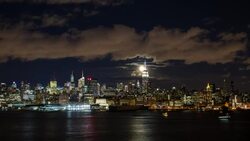 Manhattan, Moonrise over the  Empire State Building and Midtown Manhattan looking across the Hudson River, New York, United States of America - Time lapse Stock Footage