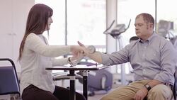Female occcupational therapist working with an adult patient Stock Footage