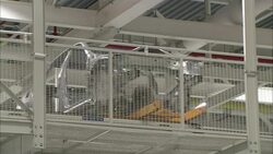 An automated conveyor moves an auto body across an automotive plant. Stock Footage