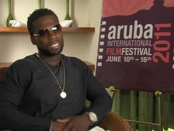 INTERVIEW 50 Cent aka Curtis Jackson on setting an example, taking responsibility, parents and more at the Aruba International Film Festival: Things Fall Apart Interview at Aruba . (Footage by WireImage Video/Getty Images Entertainment Video) Stock Footage