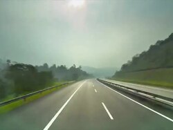 T/L pov of car on dual carriageway to Singapore Stock Footage
