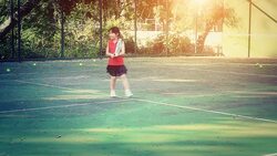 Little girl on the tennis court Stock Footage