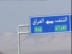 POV from car passenger looking toward sign for Iraq, Syria (sound available) Stock Footage