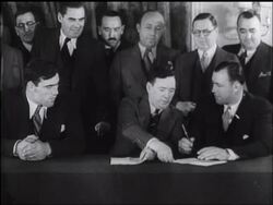 Primo Carnera and Jack Sharkey Sign Agreement News Clip