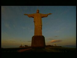 WA Low angle, Flood lit sculpture of Jesus Christ at dusk, Rio De Janeiro Stock Footage