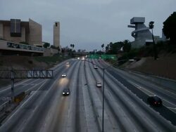 MS Shot of Light traffic moving on freeway and Los Angeles Catholic Church visible / Los Angeles, California, United States  Stock Footage
