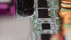 close-up panning:  many black chips on a circuit board Stock Footage