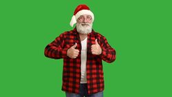 adult senior beard man dancing and calling to him  in a hat santa claus  on a green background Stock Footage