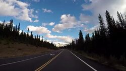 Car driving on Icefields parkway scenic road Stock Footage