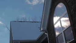 Time Lapse of Clouds Passing Reflection on Snow Covered Home Window Stock Footage