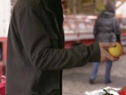 MS TS TU Shot of Man buying apple from market vendor / Potsdam, Brandenburg, Germany  Stock Footage