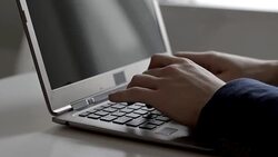 Man typing on laptop Stock Footage