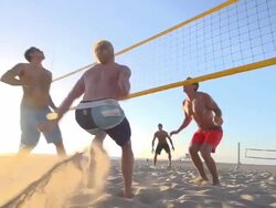 Men playing beach volleyball. - Slow Motion Stock Footage