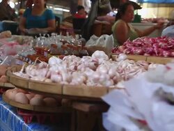 MS POV SLO MO Counter laden with packaged food products at indoor market / Vientiane, Laos Stock Footage