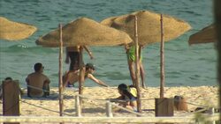 Tourists On Beach In Hammamet News Clip