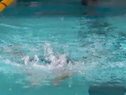 HD Super Slow-Mo: Young Woman Swimming Breaststroke Stock Footage