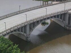 MS Cars passing through bridge over river / Minneapolis, Minnesota, United States  Stock Footage