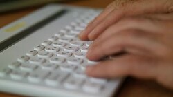 Hand typing a laptop computer Stock Footage