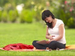 HD: Pregnant Woman Using Tablet Outdoors Stock Footage