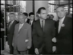 B/W 1959 tracking shot Richard Nixon + Nikita Khrushchev walking in building of American Expo / Moscow Stock Footage