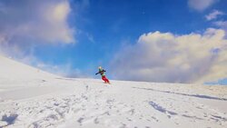 SLO MO Female snowboarder carving on ski slope Stock Footage