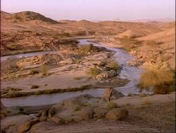 MWA River flowing through desert landscape, Algeria, Africa Stock Footage