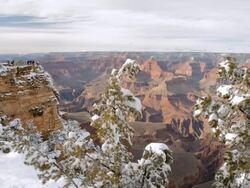 WS T/L TU Tourists overlooking snow covered Grand Canyon at Mather Point / Grand Canyon National Park, Arizona, USA Stock Footage