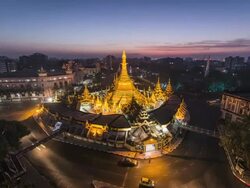 Asia, Myanmar, Yangon, elevated view of skyline and Sule Pagoda, in middle of road intersection Stock Footage