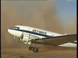 Propeller plane turning on runway, following aid mission. Lokichogio, Kenya, Africa Stock Footage