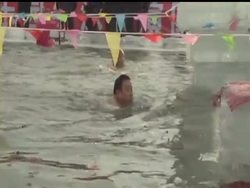 Hundreds of people compete in a Polar Bear Swim Invitational in Northeastern China. The pool is carved out of a frozen river. News Clip