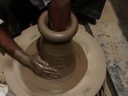 Man making a earthen pot on a pottery wheel  Stock Footage
