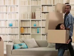 Family carrying cardboard boxes Stock Footage