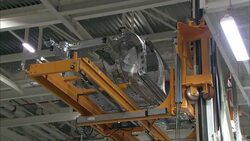 An automated lift transports auto parts in a factory. Stock Footage