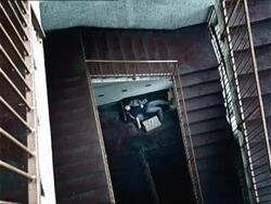 HA, WS, drug addict lying on bed under staircase, Ljubjana, Slovenia Stock Footage