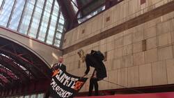 Extinction Rebellion protesters climb DLR train at Canary Wharf News Clip