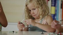Close up of girls assembling models of molecules / Orem, Utah, United States Stock Footage