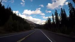Car driving on Icefields parkway scenic road Stock Footage