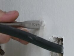 Powerdrill used to make holes in drywall at house in Pecan Street Project Stock Footage