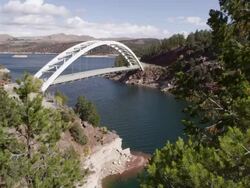 Slow pan from right to left of Cart Creek Bridge at Flaming Gorge in Utah. Stock Footage