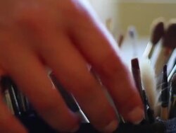 Makeup Artist's Hand Grabbing a Brush from Her Collection Stock Footage