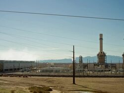 T/L, WS, Fossil fueled power plant in desert, Golden Shores, Arizona, USA Stock Footage
