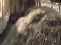 CU TU Polluted water pouring into ice / Nogliki, Sakhalin, Russia Stock Footage