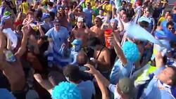 Uruguay fans celebrate win over Italy, Italian fans react to WCup exit News Clip