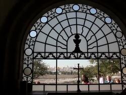 Jerusalem, Dominus Flevit Church, window above the altar through which the Temple Mount can be seen Stock Footage