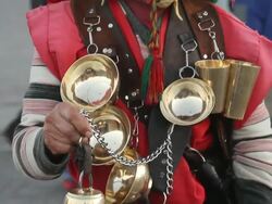 MS TU Shot of in aboriginal cloth dressed man holding bells/ Fes, Centro-North, Morocco Stock Footage