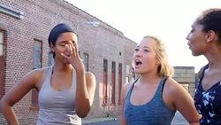 MS Laughing group of women resting after morning run through city Stock Footage