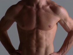 Medium shot tilt up chest of young man / London Stock Footage