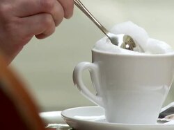 CU TU TD Woman putting suger in coffee, stiring and drinking / Dresden, Saxony, Germany Stock Footage